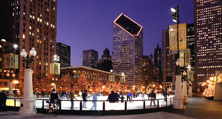 People skating in outdoor ice rink in Chicago