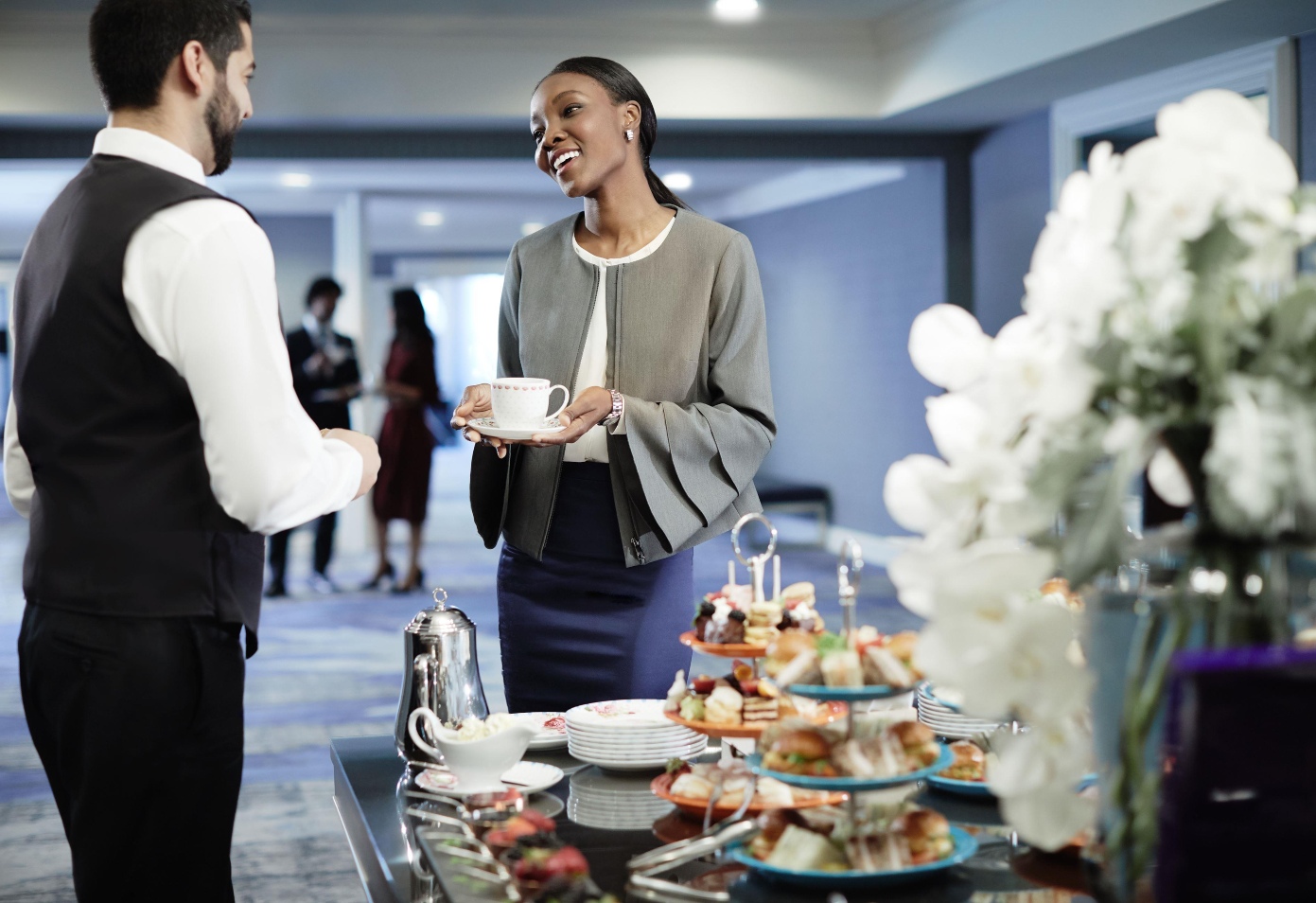 two people talking over tea