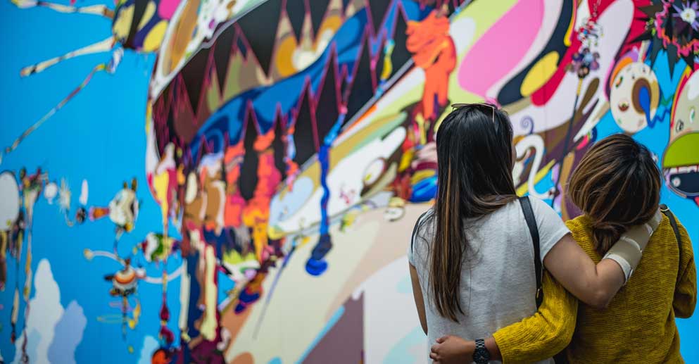 people looking at art
